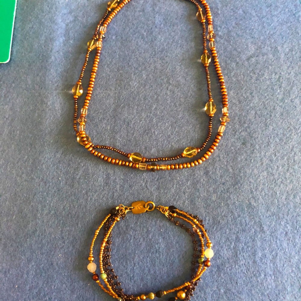 Beaded necklace and bracelet. Each have multi strands. Sterling silver clasp